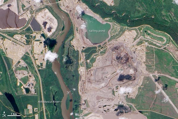 The Athabasca oil sands cause a great deal of environmental destruction which can be seen from space The Athabasca oil sands cause a great deal of environmental destruction which can be seen from space